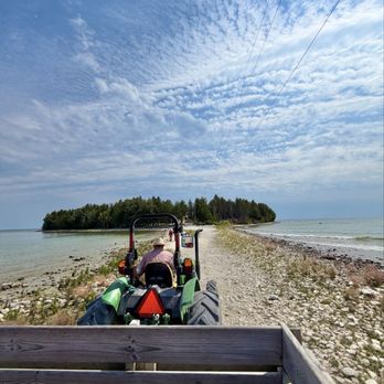 Cana Island Lighthouse - Tractor across causeway - Landmarks & Historical Buildings Near Me - Baileys Harbor, Wisconsin