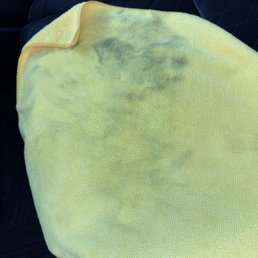 Oil and grease pulled off from drivers door, steering wheel and seat.