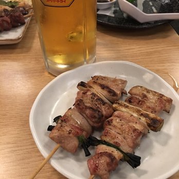 Torikyu - Chicken thigh w/ green onion. Asahi super dry representin in he background! - Japanese Near Me - Honolulu, Hawaii Torikyu - Chicken thigh w/ green onion. Asahi super dry representin in he background! - Japanese Near Me - Honolulu, Hawaii