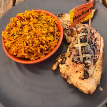 Nando's Peri-Peri - 1/4 Chicken - Leg & Thigh Portuguese Rice - South African Near Me - Chicago, Illinois Nando's Peri-Peri - 1/4 Chicken - Leg & Thigh Portuguese Rice - South African Near Me - Chicago, Illinois