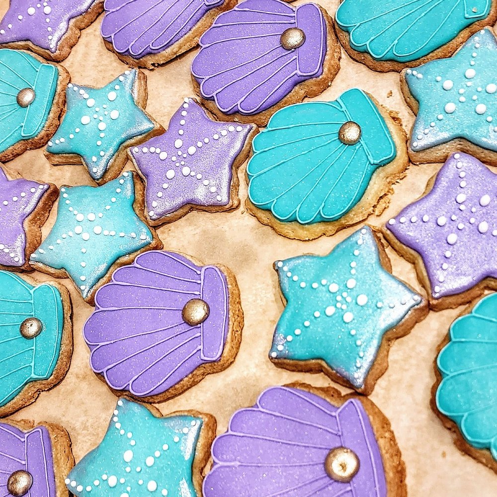Amazing Cakes - Shortbread cookies for "Under the Sea" theme. Iridescent white frosting touches and iridescent gold dots too. Beautiful and tasty. - Cupcakes Near Me - Vancouver, Washington
