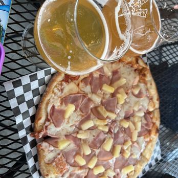Wenatchee Valley Brewing Company - $19.50 pizza next to the delicious beers for size! - Breweries Near Me - Wenatchee, Washington