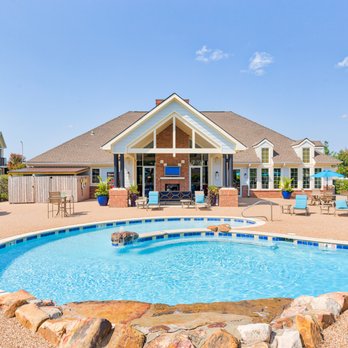 Eastland Trails Apartments - Resort-style pool and sundeck at Eastland Trails with lounge seating, outdoor grilling space, and clubhouse access. - Apartments Near Me - Independence, Missouri Eastland Trails Apartments - Resort-style pool and sundeck at Eastland Trails with lounge seating, outdoor grilling space, and clubhouse access. - Apartments Near Me - Independence, Missouri