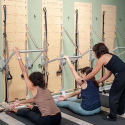  On the Move Physical Therapy and Pilates - Pilates class using spring board