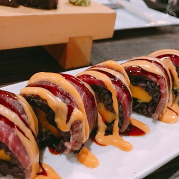 Sun Cuisines - Beef tataki roll with unnecessary over flavored sauce on top - Burmese Near Me - Williamsville, New York