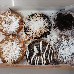 Duck Donuts - Two Pumpkin Coffee Cake, one Coconut Island Bliss, one S'mores, and two different oreo donuts.