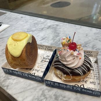 Donutique - Left: Lemon Roll Croissant Rt: Neapolitan Donut - Yummy - Coffee & Tea Near Me - Las Vegas, Nevada Donutique - Left: Lemon Roll Croissant Rt: Neapolitan Donut - Yummy - Coffee & Tea Near Me - Las Vegas, Nevada