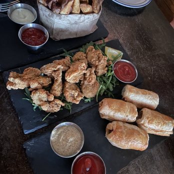 The Workman's Friend - bag of chips, fried oysters, sausage rolls - Irish Pub Near Me - Charlotte, North Carolina The Workman's Friend - bag of chips, fried oysters, sausage rolls - Irish Pub Near Me - Charlotte, North Carolina