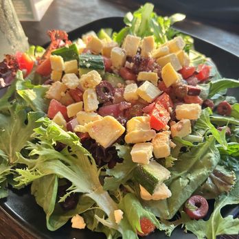 Jeremy's Farm to Table - Greek Salad - Organic mixed greens, Kalamata olives, tomatoes, cucumbers, and onions. Garlic & herb vinaigrette and local feta cheese. - New American Near Me - Chehalis, Washington