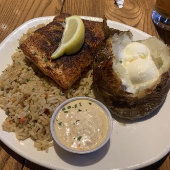 Outback Steakhouse - Perfectly Grilled Salmon, baked potato, and rice - Steakhouses Near Me - Newark, Delaware Outback Steakhouse - Perfectly Grilled Salmon, baked potato, and rice - Steakhouses Near Me - Newark, Delaware