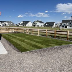 Terra Vista Landscape - Beautiful Kentucky Bluegrass install with a roll top edging as borden and 3/4 granite bed