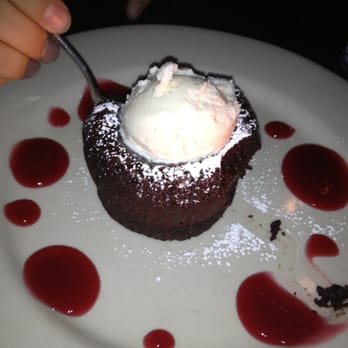 Tavern on the Hill - Warm chocolate cake with ice cream and raspberry drizzle - Desserts Near Me - Easthampton, Massachusetts Tavern on the Hill - Warm chocolate cake with ice cream and raspberry drizzle - Desserts Near Me - Easthampton, Massachusetts