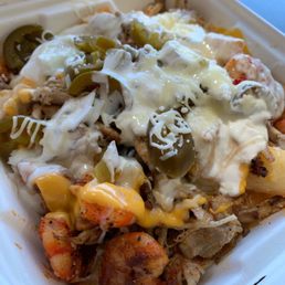 Chicken and shrimp cheese fries Chicken and shrimp cheese fries