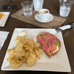 Stacks Espresso Bar - Troy - Smoked salmon toast with hard boiled egg, sliced avocado, and garlic dill cream cheese and a side of chips
