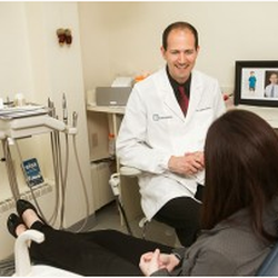 Dores Dental - Dr. James Dores of Dores Dental speaking with a patient!