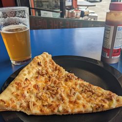 Handlebar - Delicious garlic and gouda slice. Crispy flavorful slice and the option for garlic butter on the crust!
