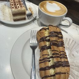 Tiramisu, eclair with chocolate drizzle Tiramisu, eclair with chocolate drizzle