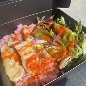 Lovebite Dumplings - Chicken, shrimp, pork and veggie dumplings with their pink rice + greens. Topped with yuzu soy and sriracha. - Dim Sum Near Me - Phoenix, Arizona