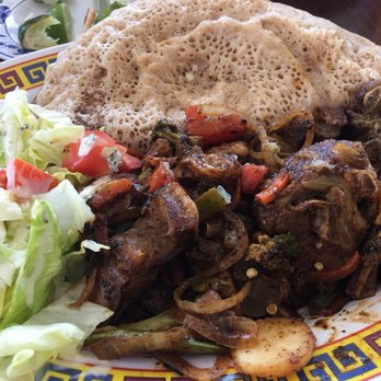 Jubba - Goat platter with injera. - African Near Me - San Jose, California