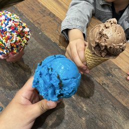 Strawberry ice cream cone with sprinkles, blue monster ice cream cone and chocolate ice cream cone