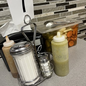 Taqueria Los Comales 3 - Two types of sauces, salt, sugar, and canister of pickles at every table - Mexican Near Me - Chicago, Illinois Taqueria Los Comales 3 - Two types of sauces, salt, sugar, and canister of pickles at every table - Mexican Near Me - Chicago, Illinois