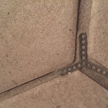 K & K Flooring Services - one of about 30 tile spacers that they grouted into the floor. - Flooring Near Me