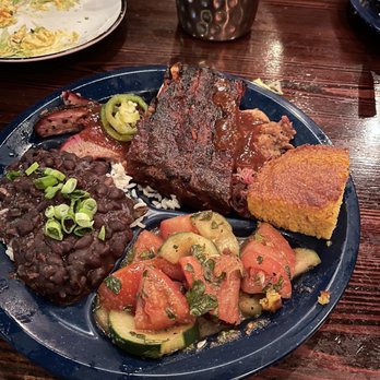 Dinosaur Bar-B-Que - Pulled pork, ribs, brisket, black beans and rice, and tomato cucumber salad - Barbeque Near Me - Syracuse, New York Dinosaur Bar-B-Que - Pulled pork, ribs, brisket, black beans and rice, and tomato cucumber salad - Barbeque Near Me - Syracuse, New York