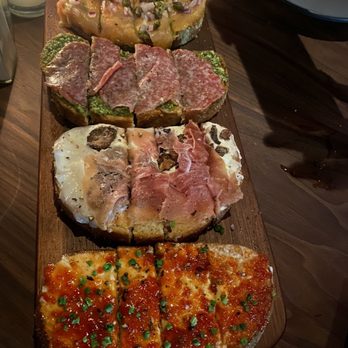 Postino Addison - Bruschetta Board (smoked salmon & pesto, salami & pesto, Prosciutto Di Parma, Fig & Mascarpone and Sweet N' Spicy Pepper Jam & Goat Cheese - Wine Bars Near Me - Dallas, Texas Postino Addison - Bruschetta Board (smoked salmon & pesto, salami & pesto, Prosciutto Di Parma, Fig & Mascarpone and Sweet N' Spicy Pepper Jam & Goat Cheese - Wine Bars Near Me - Dallas, Texas
