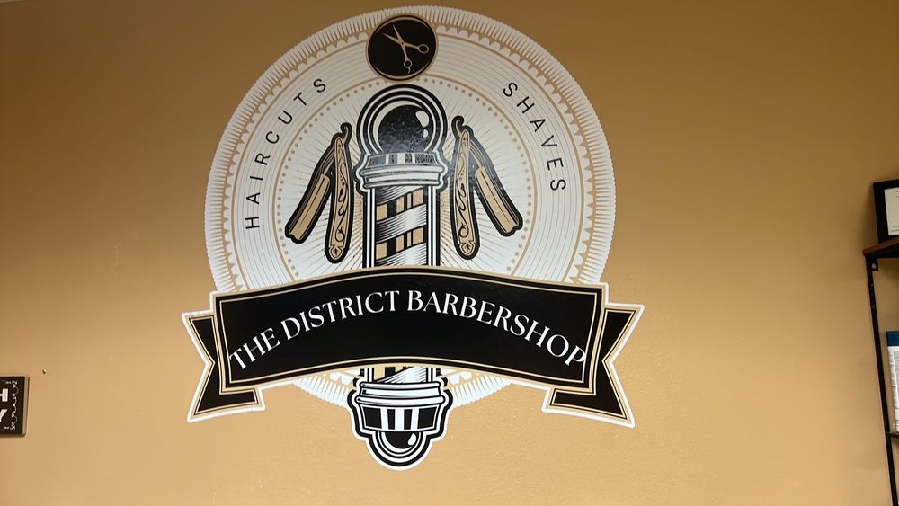 The District Barbershop Logo
