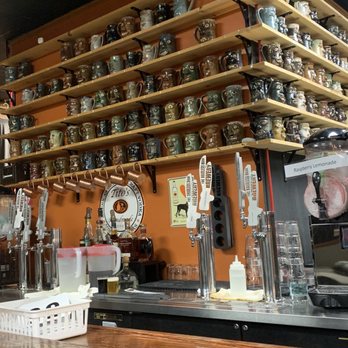 Hairless Hare Brewery - shelves of beer and mugs - Breweries Near Me - Vandalia, Ohio