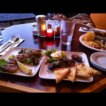 Bread and Ink Cafe - Gulf shrimp on the right and fig, cheese, pita plate on the left - all off the happy hour menu - Breakfast & Brunch Near Me - Portland, Oregon
