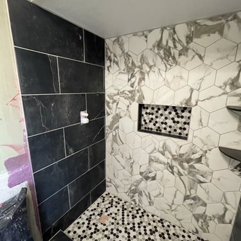 The Tile Shop - a shower with black and white tiles - Flooring Near Me - Tempe, Arizona