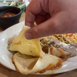 The slice cheese in my cheese enchilada.