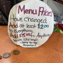 895 Grill/Pitstop - Sign of notifying customers of price Change on menu/flyer.
