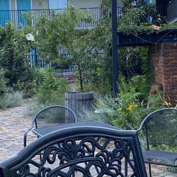Cascades Inn - The court yard looking at weeds - Hotels Near Me - Bloomington, Indiana