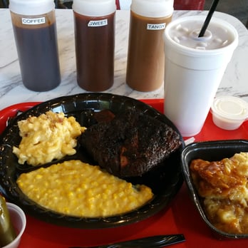 Killen's Barbecue - Beef rib plate w/ creamed corn and mac 'n' cheese for $15.95. Sweet tea and bread pudding to right. All $24. - Barbeque Near Me - Pearland, Texas Killen's Barbecue - Beef rib plate w/ creamed corn and mac 'n' cheese for $15.95. Sweet tea and bread pudding to right. All $24. - Barbeque Near Me - Pearland, Texas