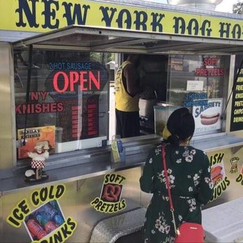 NY Dog House - a woman standing in front of a food cart - Food Trucks Near Me - Spring Hill, Florida NY Dog House - a woman standing in front of a food cart - Food Trucks Near Me - Spring Hill, Florida