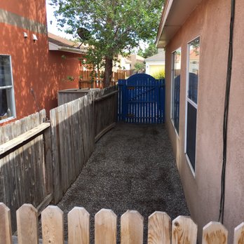 Martinez Design & Scape - Dog run prior to work done. No rock of any kind back there - Tree Services Near Me