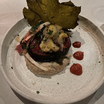 Krasi - XTAPODI vine leaf braised octopus, burnt celeriac, leeks, Florina pepper marmelada - Mediterranean Near Me - Boston, Massachusetts Krasi - XTAPODI vine leaf braised octopus, burnt celeriac, leeks, Florina pepper marmelada - Mediterranean Near Me - Boston, Massachusetts
