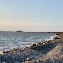 Dauphin Island - The quiet beach shores with a 3-mile bridge that connects the mainland and Dauphin Island in the distance.