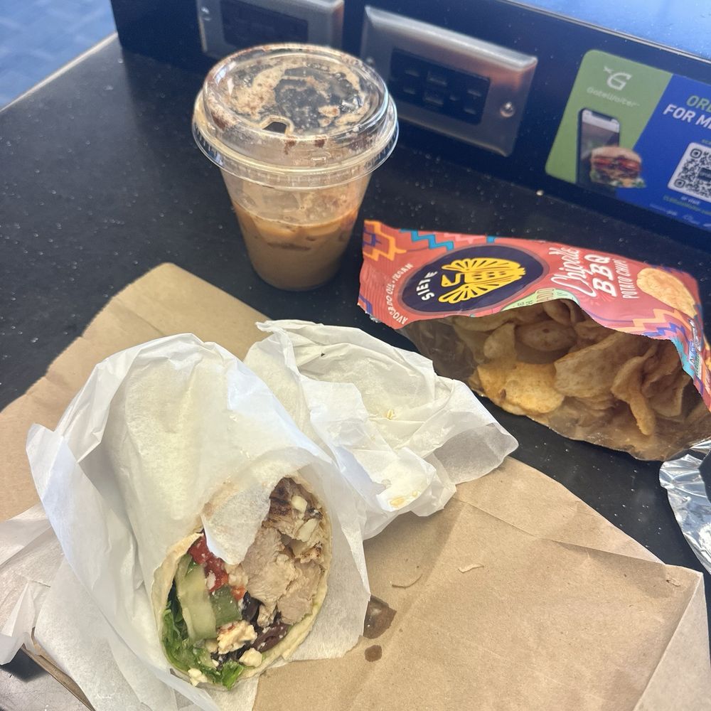 Mediterranean chicken wrap, dirty iced chai, and siete chips. Mediterranean chicken wrap, dirty iced chai, and siete chips.