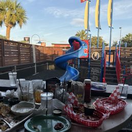 Patio dining with view of the playground. Patio dining with view of the playground.