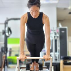 Vitality Method Studio - Long stretch on the classical Pilates Reformer