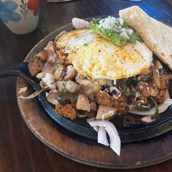 Casa Lola - Chorizo con Papas Skillet with over-medium eggs and flour tortilla. - Mexican Near Me - Sacramento, California
