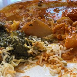 Chicken tikka masala, basmati rice, and a spinach dish