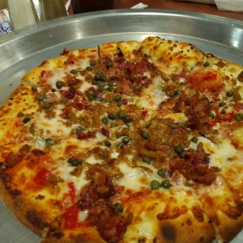 Richard's Brick Oven Pizza - Sausage pizza with capers from the "build your own" option. - Pizza Near Me - Franklin, Indiana Richard's Brick Oven Pizza - Sausage pizza with capers from the "build your own" option. - Pizza Near Me - Franklin, Indiana