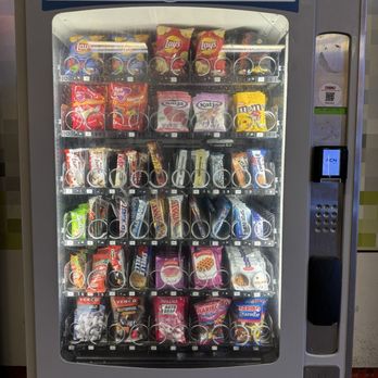 Station Amsterdam Zuid - Train station vending machine - with selection of gummy candies, stroopwafels, Belgian waffles - Train Stations Near Me - Amsterdam, New Hampshire
