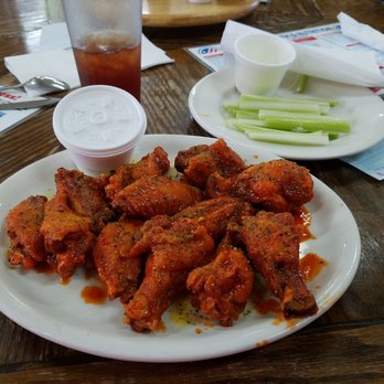 Broiler Room Restaurant - a plate of buffalo wings and celery - American Near Me - Lincoln, Alabama Broiler Room Restaurant - a plate of buffalo wings and celery - American Near Me - Lincoln, Alabama