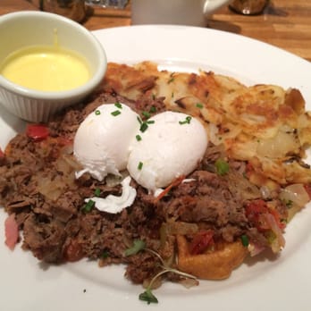 Iron Rooster - Smokehouse Brisket Benny... House-made brisket that melts in your mouth, served on a jalapeño cornbread waffle.  Perfect blend! - Cocktail Bars Near Me - Annapolis, Maryland