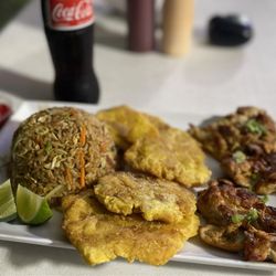 J M Fusión Cuisine - Asian fried rice with grilled chicken and tostones